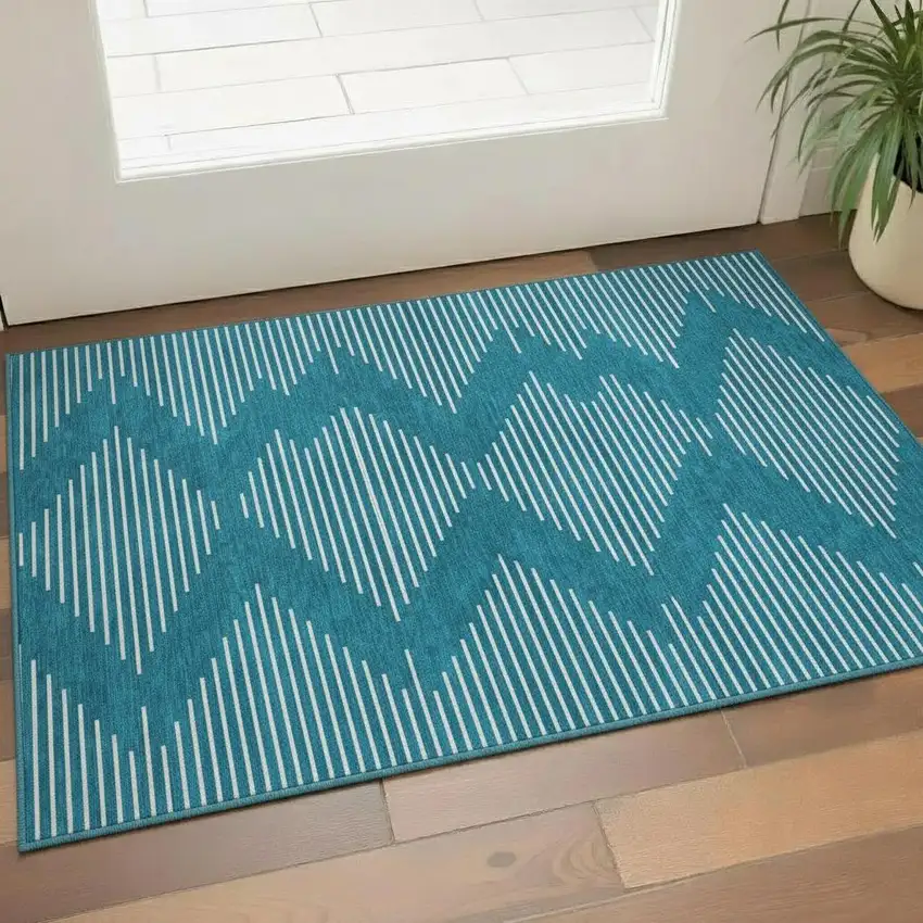 Teal And Ivory Geometric Washable Area Rug With UV Protection Photo 2