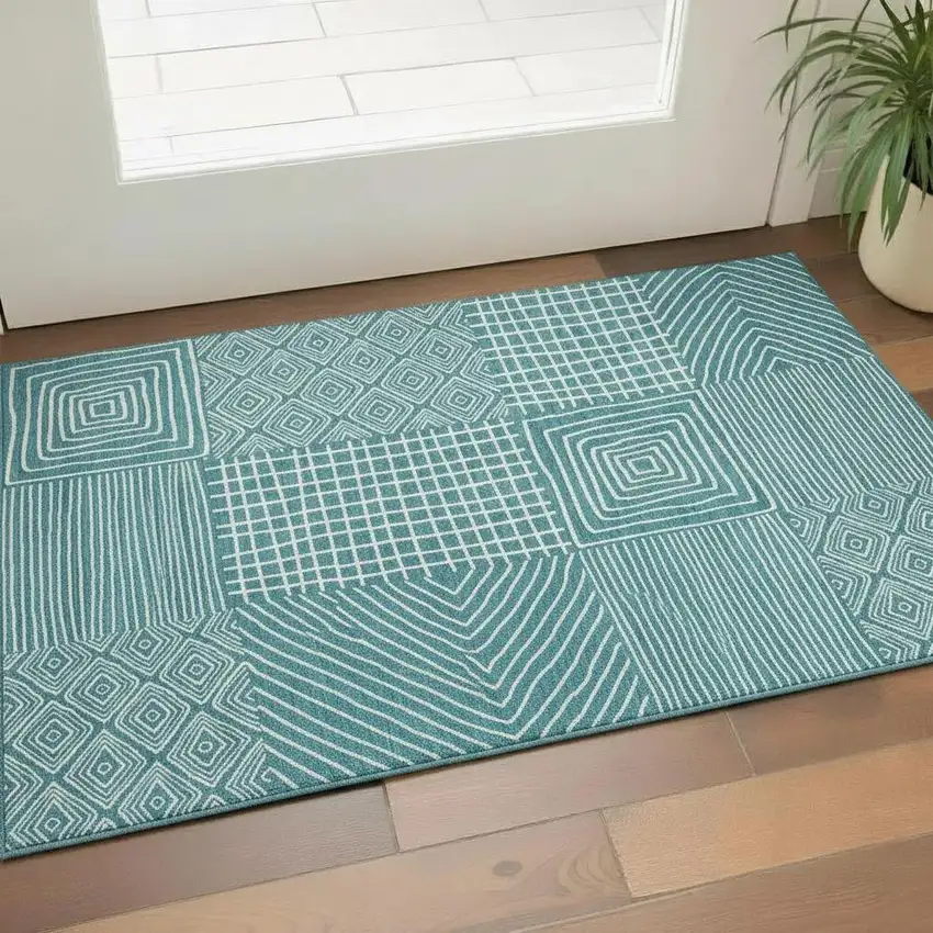 Teal And Ivory Geometric Washable Area Rug With UV Protection Photo 2