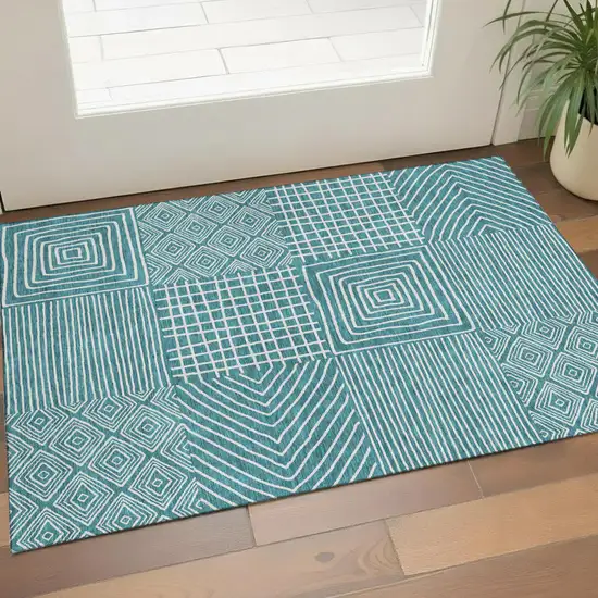 Teal And Ivory Geometric Washable Area Rug With UV Protection Photo 1
