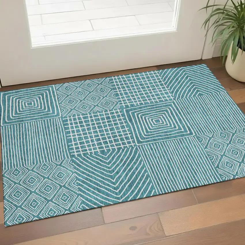 Teal And Ivory Geometric Washable Area Rug With UV Protection Photo 1