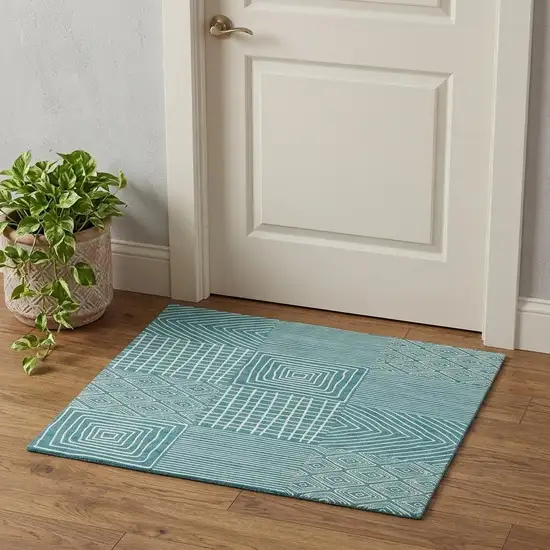 Teal And Ivory Geometric Washable Area Rug With UV Protection Photo 1