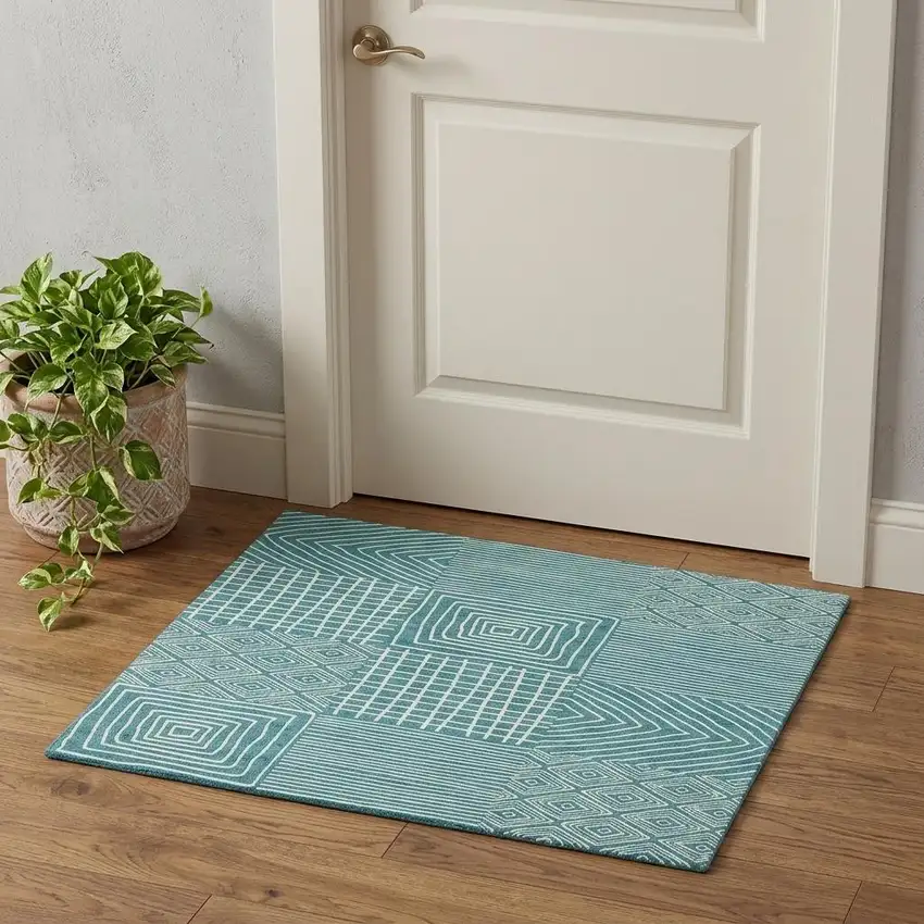 Teal And Ivory Geometric Washable Area Rug With UV Protection Photo 1
