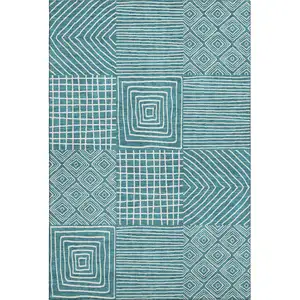 Photo of Teal And Ivory Geometric Washable Area Rug With UV Protection
