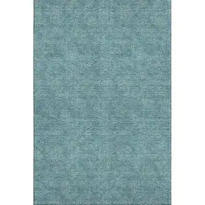 Photo of Teal And Ivory Geometric Washable Area Rug With UV Protection