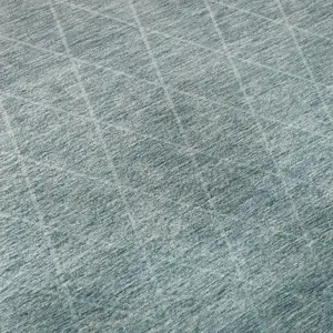 Photo of Teal And Ivory Geometric Washable Area Rug With UV Protection