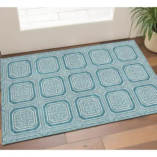 Teal And Ivory Geometric Washable Area Rug With UV Protection Photo 1