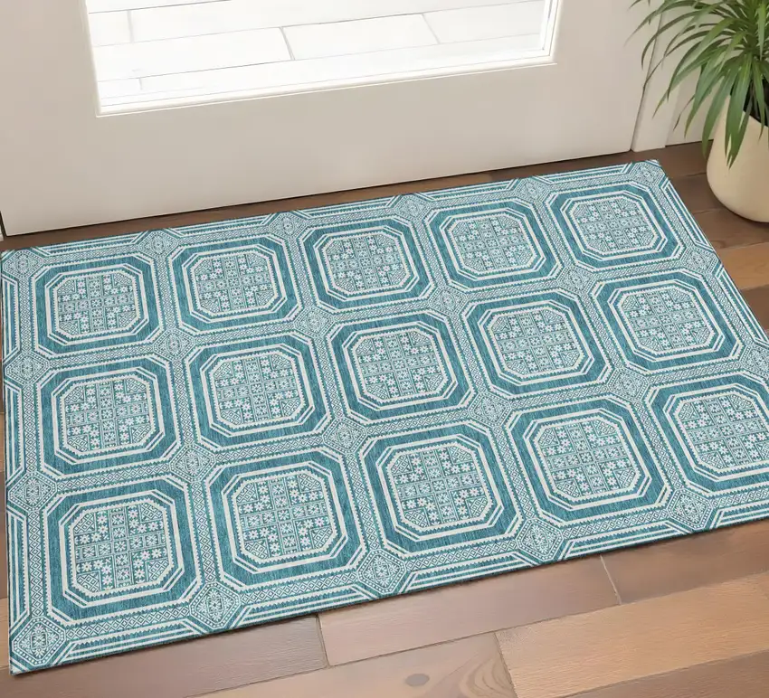 Teal And Ivory Geometric Washable Area Rug With UV Protection Photo 1