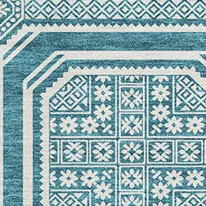 Photo of Teal And Ivory Geometric Washable Area Rug With UV Protection