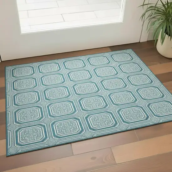 Teal And Ivory Geometric Washable Area Rug With UV Protection Photo 2