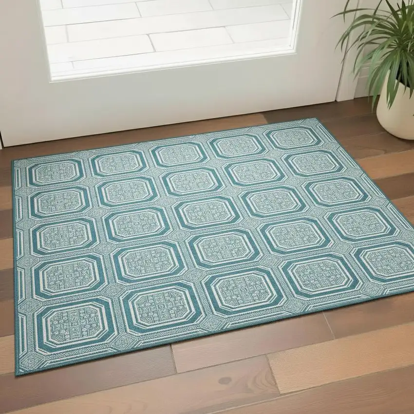 Teal And Ivory Geometric Washable Area Rug With UV Protection Photo 2