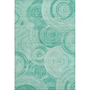 Photo of Teal And Ivory Geometric Washable Area Rug With UV Protection