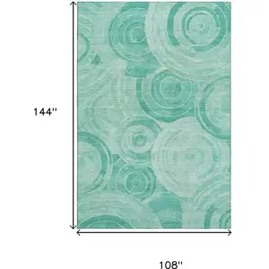 Photo of Teal And Ivory Geometric Washable Area Rug With UV Protection