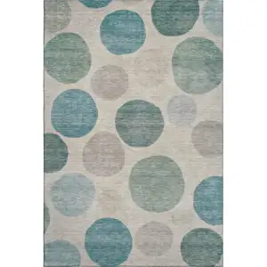 Photo of Teal And Ivory Geometric Washable Area Rug With UV Protection