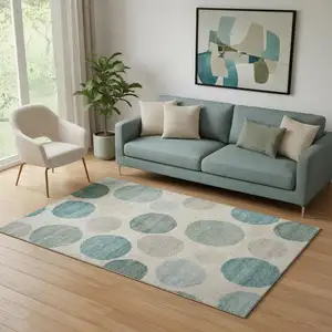 Photo of Teal And Ivory Geometric Washable Area Rug With UV Protection