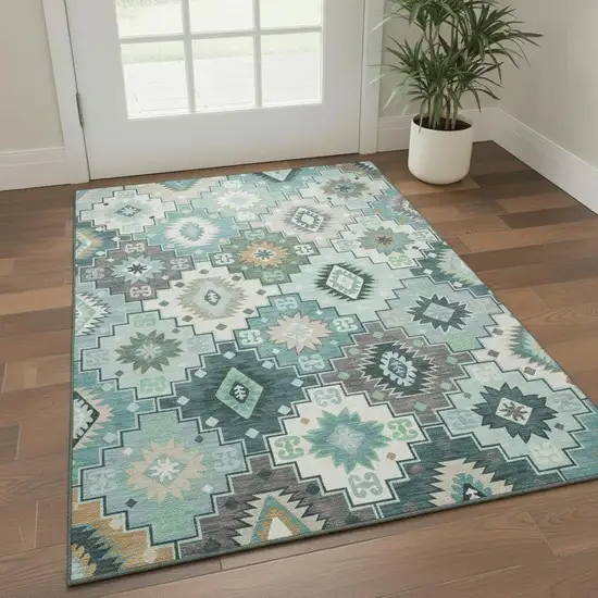 Teal And Ivory Geometric Washable Area Rug With UV Protection Photo 1