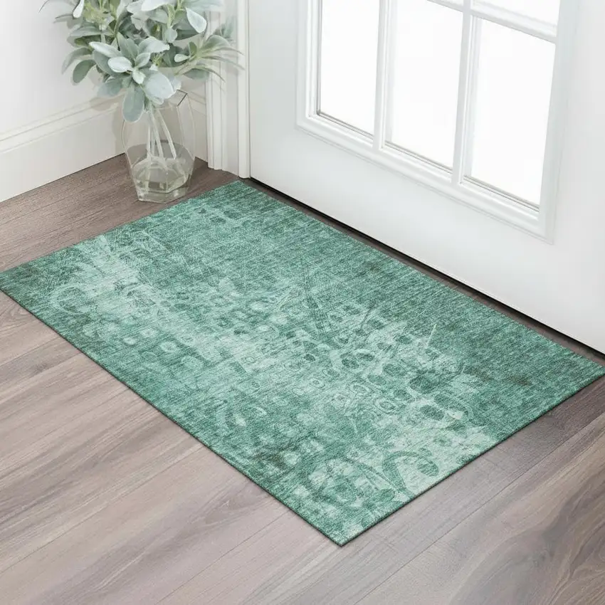 Teal And Ivory Ikat Washable Area Rug With UV Protection Photo 1