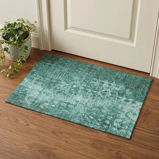 Teal And Ivory Ikat Washable Area Rug With UV Protection Photo 1