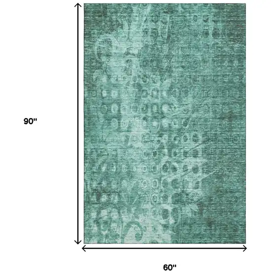 Teal And Ivory Ikat Washable Area Rug With UV Protection Photo 3