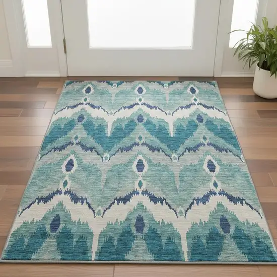 Teal And Ivory Ikat Washable Area Rug With UV Protection Photo 2