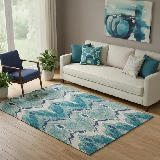 Teal And Ivory Ikat Washable Area Rug With UV Protection Photo 1