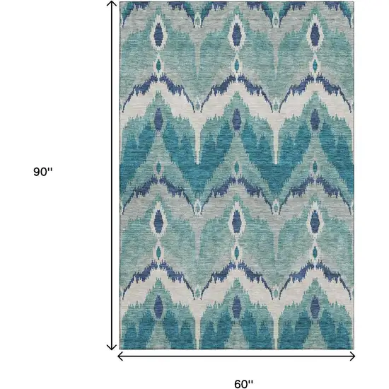 Teal And Ivory Ikat Washable Area Rug With UV Protection Photo 3