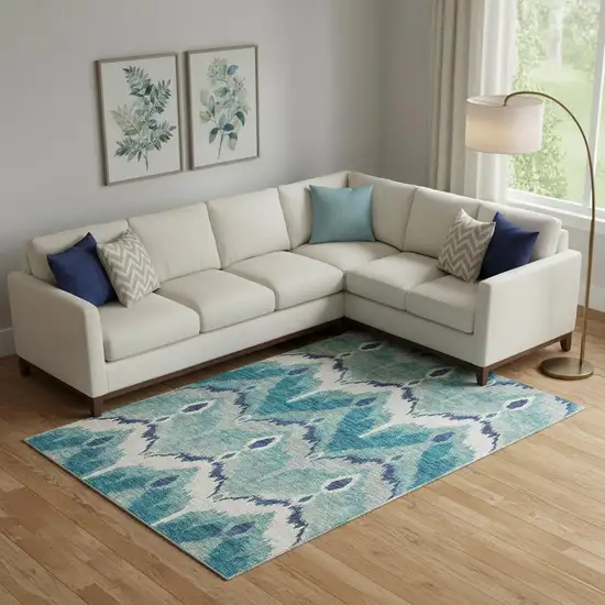 Teal And Ivory Ikat Washable Area Rug With UV Protection Photo 1