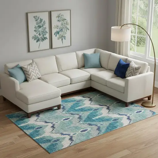 Teal And Ivory Ikat Washable Area Rug With UV Protection Photo 1