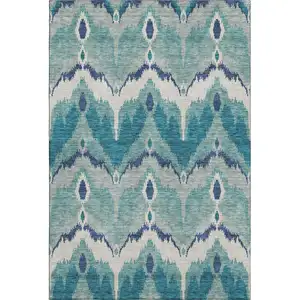 Photo of Teal And Ivory Ikat Washable Area Rug With UV Protection