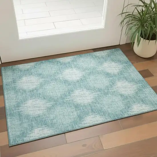Teal And Ivory Ikat Washable Area Rug With UV Protection Photo 1