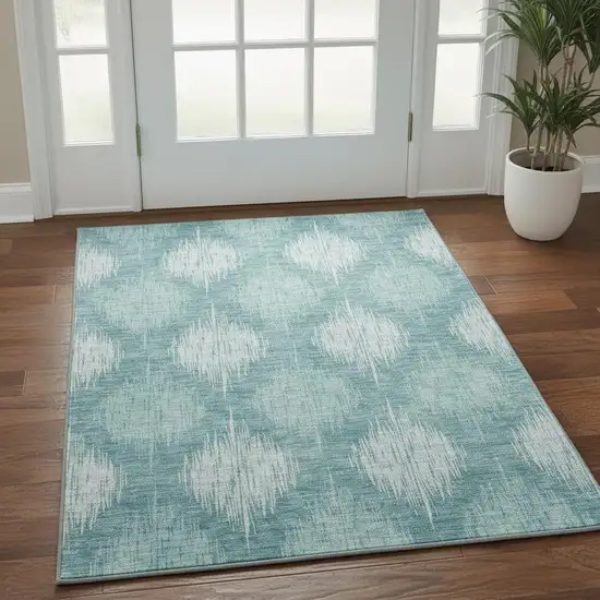 Teal And Ivory Ikat Washable Area Rug With UV Protection Photo 2