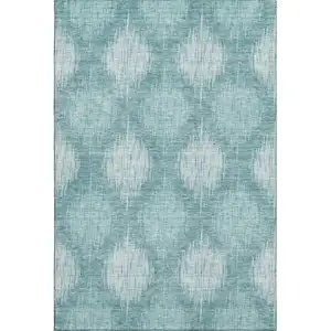 Photo of Teal And Ivory Ikat Washable Area Rug With UV Protection