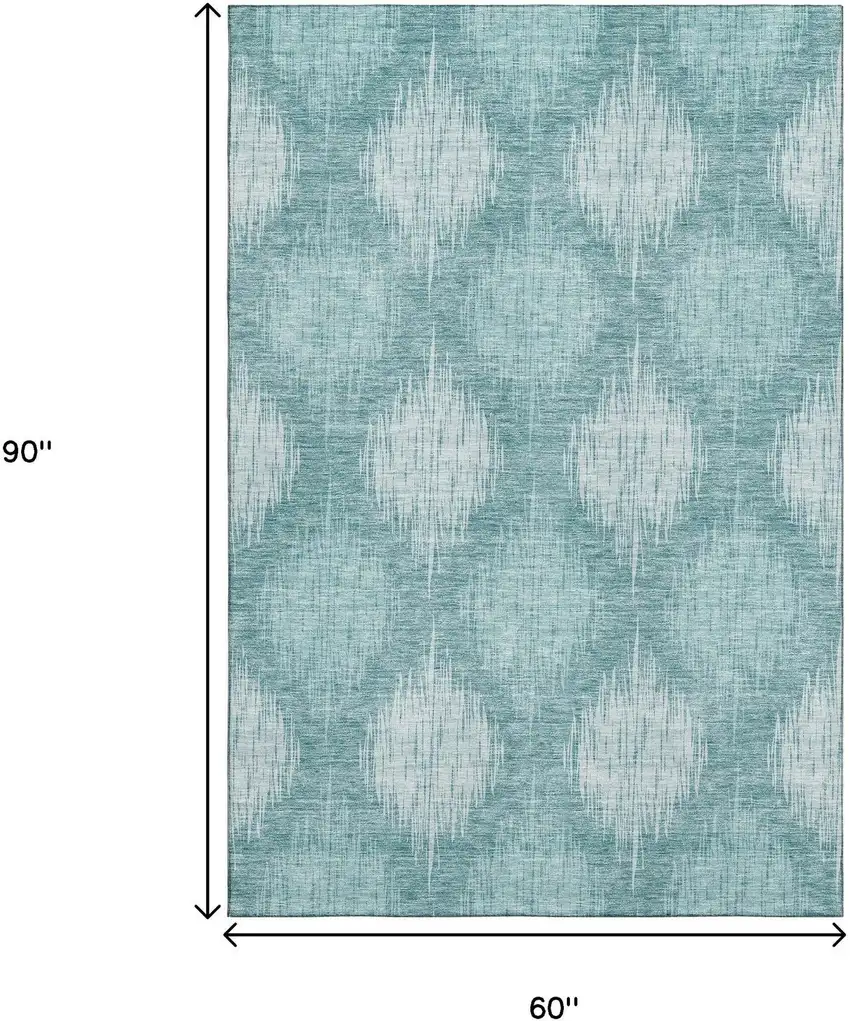 Teal And Ivory Ikat Washable Area Rug With UV Protection Photo 3