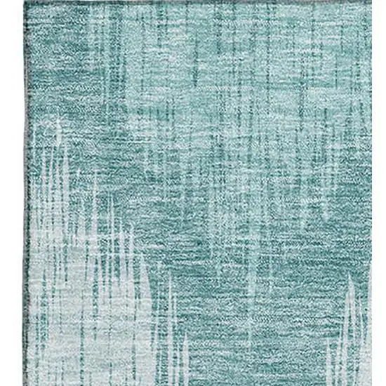 Teal And Ivory Ikat Washable Area Rug With UV Protection Photo 3