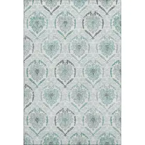 Photo of Teal And Ivory Medallion Washable Area Rug With UV Protection