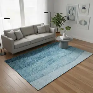 Photo of Teal And Ivory Ombre Washable Area Rug With UV Protection