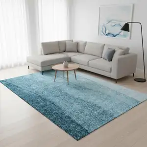 Photo of Teal And Ivory Ombre Washable Area Rug With UV Protection