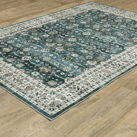 Teal And Ivory Oriental Distressed Area Rug Photo 9