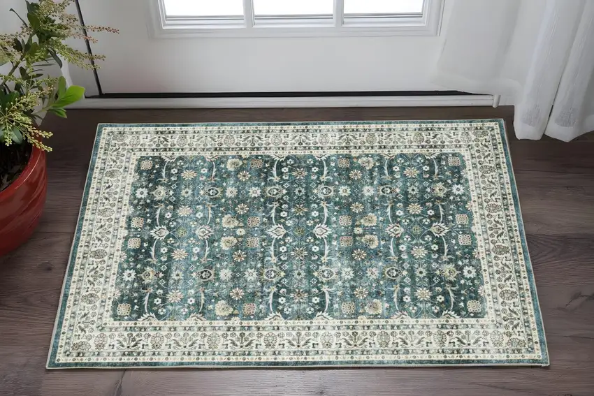 Teal And Ivory Oriental Distressed Area Rug Photo 1