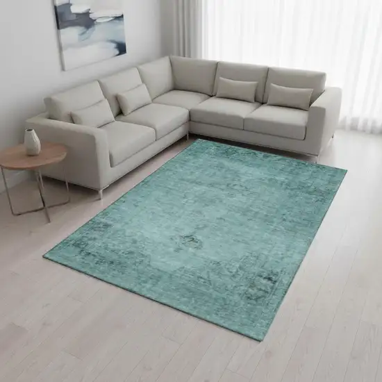 Teal And Ivory Oriental Washable Area Rug With UV Protection Photo 1