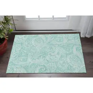 Photo of Teal And Ivory Paisley Washable Area Rug With UV Protection