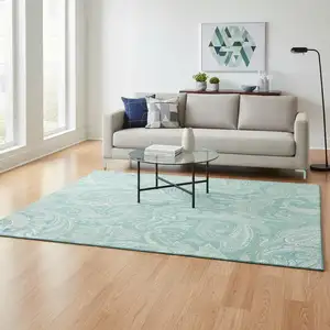 Photo of Teal And Ivory Paisley Washable Area Rug With UV Protection
