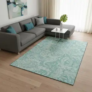 Photo of Teal And Ivory Paisley Washable Area Rug With UV Protection