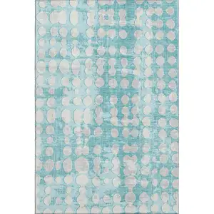 Photo of Teal And Ivory Polka Dot Washable Area Rug With UV Protection