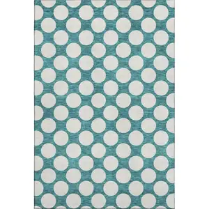 Photo of Teal And Ivory Polka Dot Washable Area Rug With UV Protection