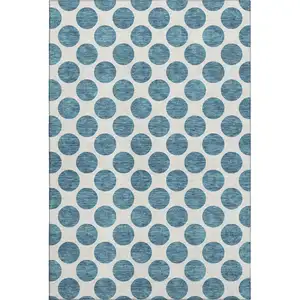 Photo of Teal And Ivory Polka Dot Washable Area Rug With UV Protection