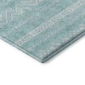Photo of Teal And Ivory Southwestern Washable Area Rug With UV Protection