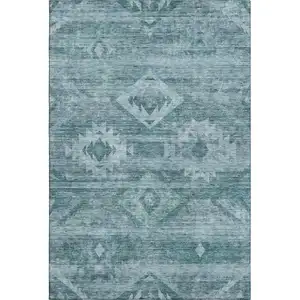 Photo of Teal And Ivory Southwestern Washable Area Rug With UV Protection