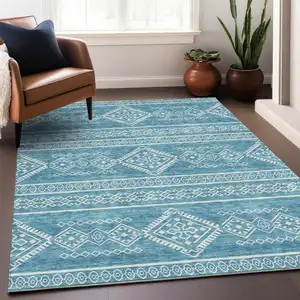 Photo of Teal And Ivory Southwestern Washable Area Rug With UV Protection