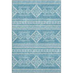 Photo of Teal And Ivory Southwestern Washable Area Rug With UV Protection