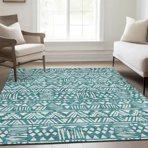 Photo of Teal And Ivory Southwestern Washable Area Rug With UV Protection